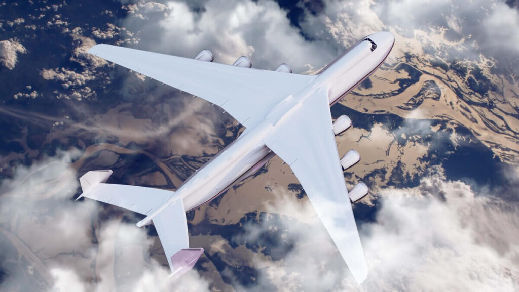 Un avion de ligne volant au-dessus des nuages, illustrant la question des voyages pour les porteurs de cavernome.